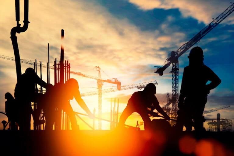 Construction worker Concrete pouring during commercial concreting floors of building in construction site and Civil Engineer