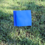 Solid Color Marking Flags In The Field Blue