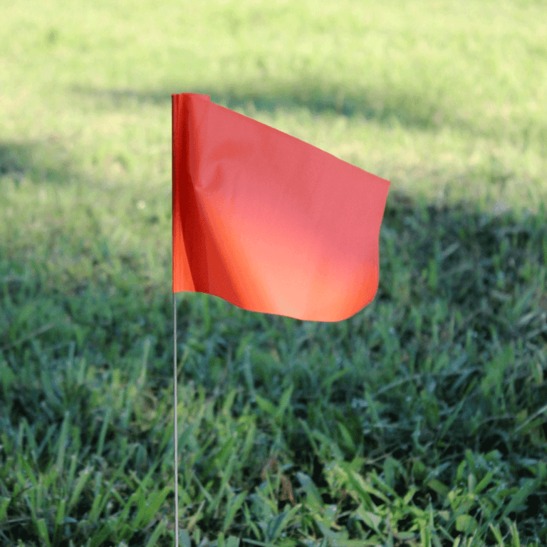 Solid Color Marking Flags In The Field Orange
