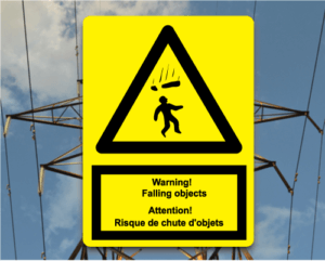 Cell Tower Safety Identification sign saying: Warning! Falling objects. Attention! Resque de chute d'objets